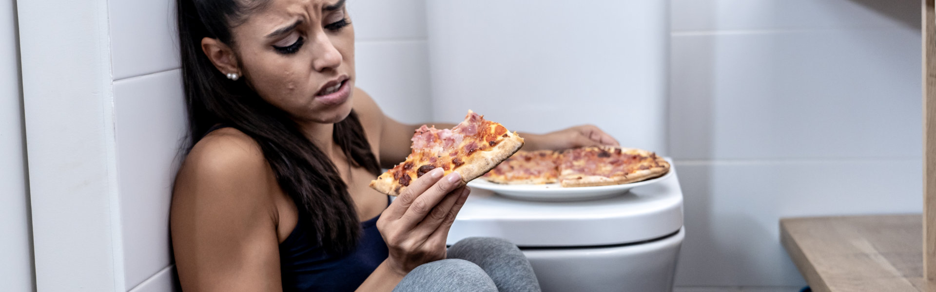 A woman staring on pizza